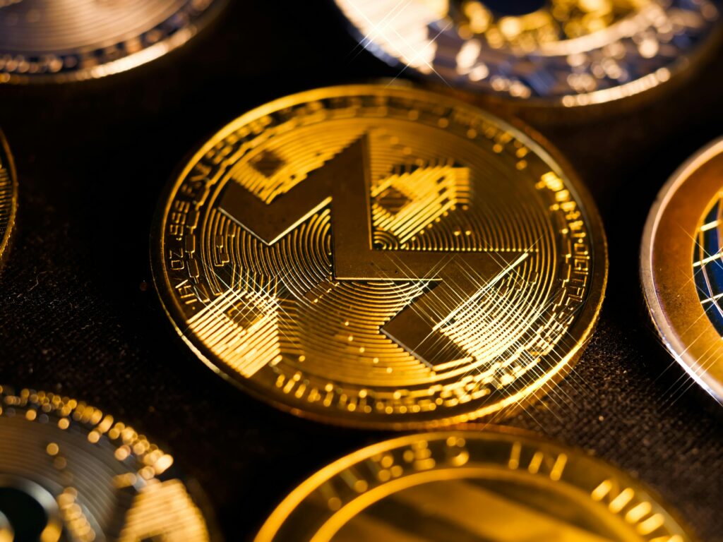 Shiny gold Monero coin close-up, focusing on digital currency aesthetics and investment potential.
