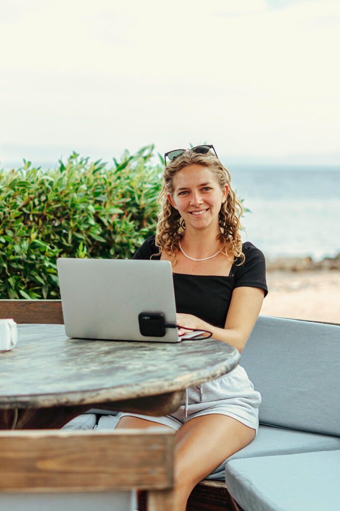 digital nomad, work online, cowork, laptop, macbook, beach, sea, work, workplace, location independent, sun, call, zoom, meeting, online meeting, webinar, video conference, online, nature, teams, hands, pretty, woman